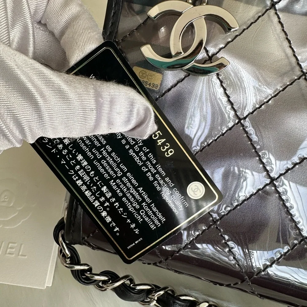 CHANEL Silver Quilted PVC Shoulder Bag with Black Trim